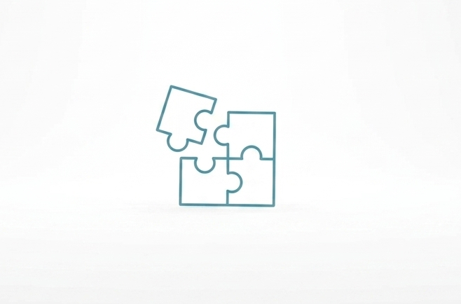 Logo stilizzato Psicologa Marta Valentini: puzzle in composizione con lo sfondo bianco e bordi in azzurro scuro, simbolo di un percorso psicologico intrapreso.